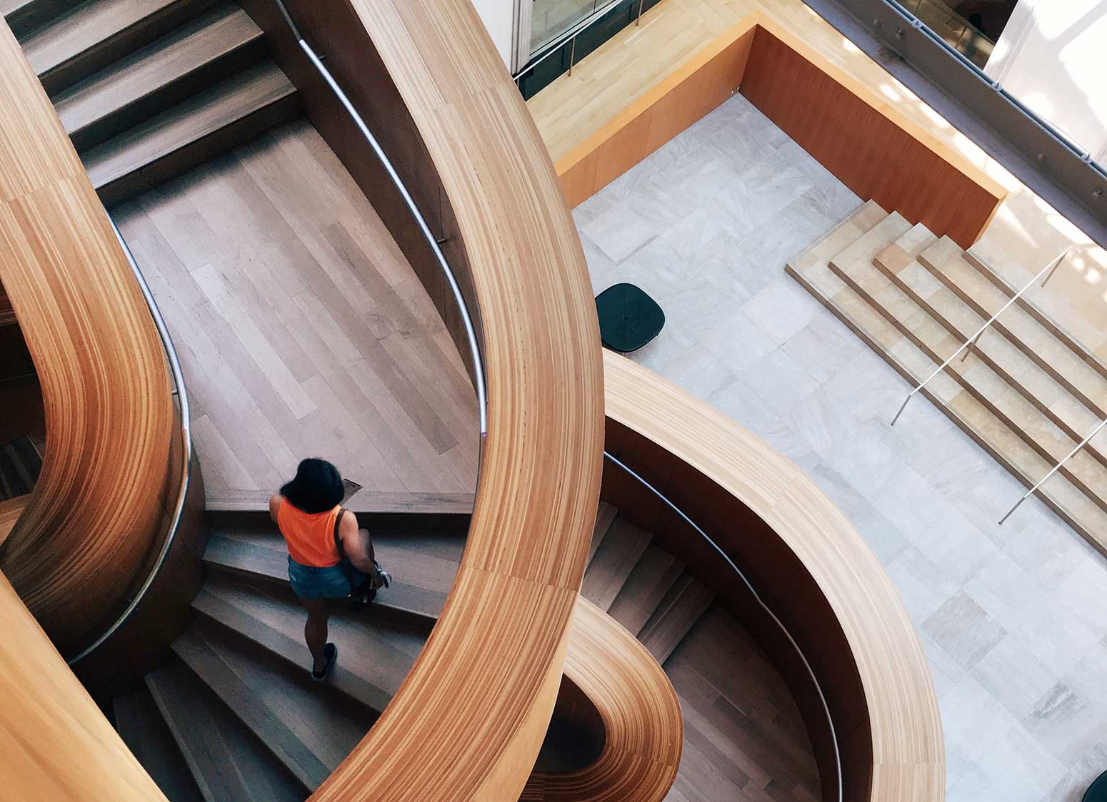 Person climbing designer staircase