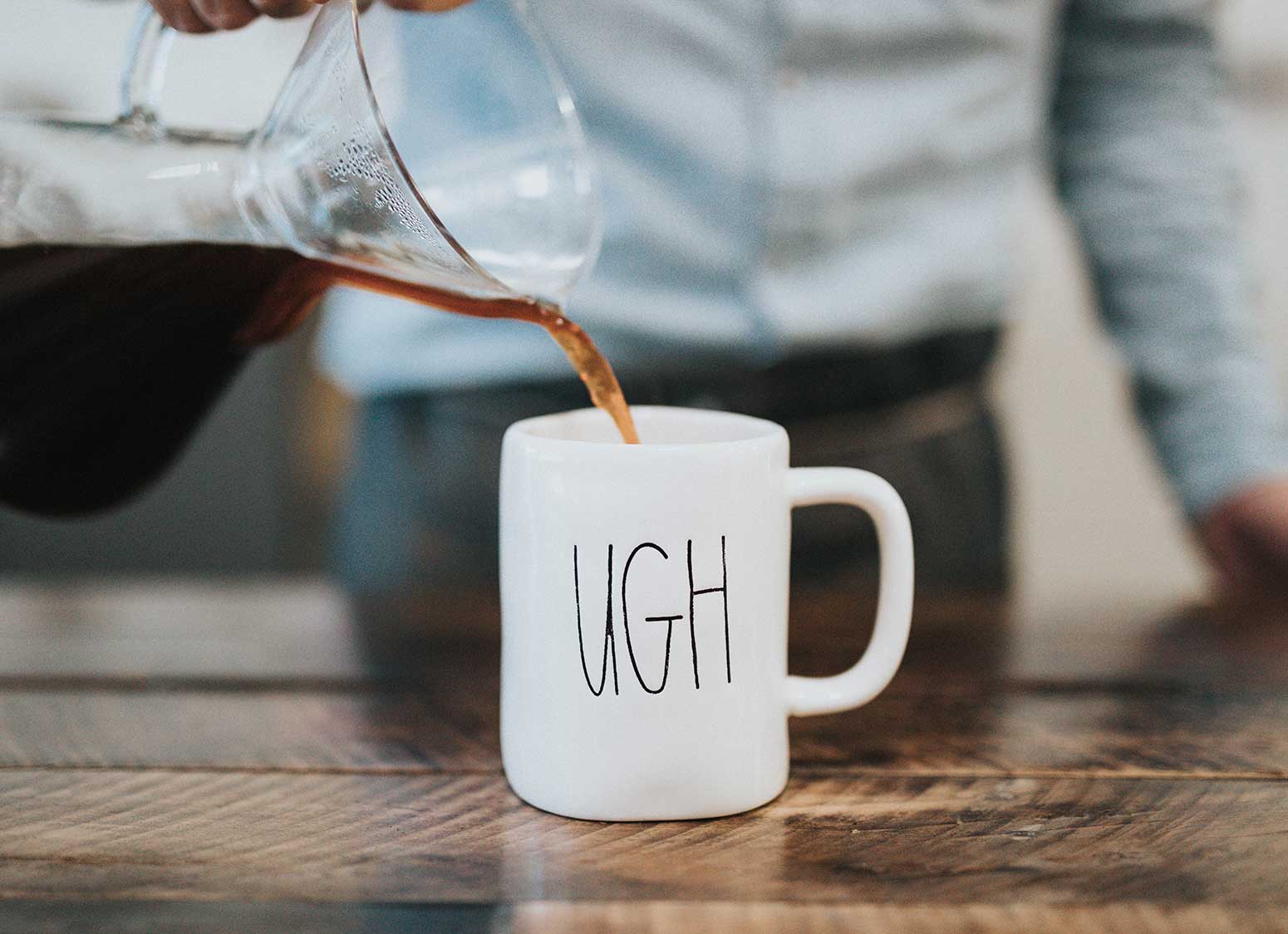 Pouring Coffee Into Mug Labeled "Ugh"
