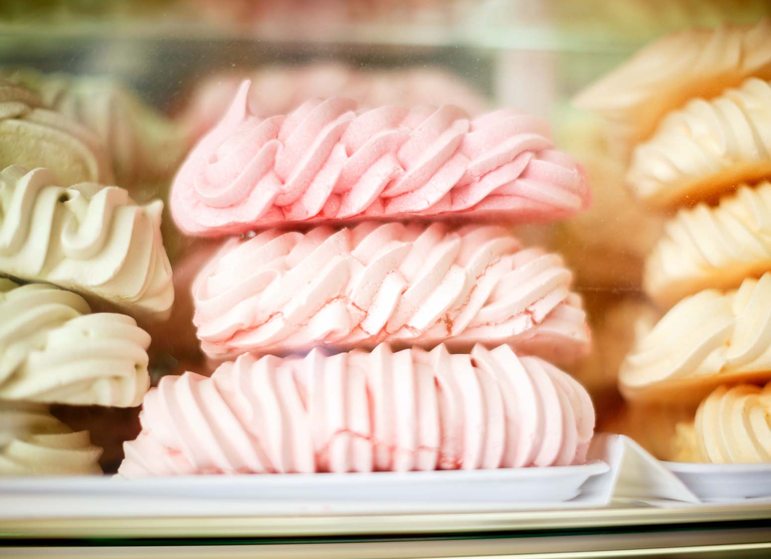 green, pink and golden meringue cookies