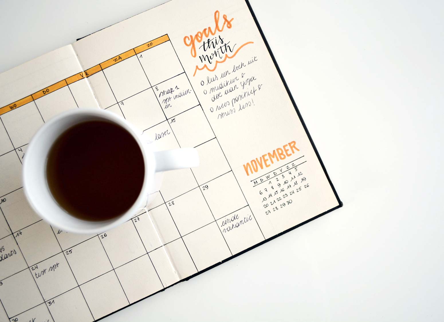 coffee cup on monthly agenda